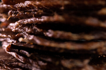 Close-up of a piece of meat on a wooden Board with spices. Restaurant menu, a series of photos of different dishes