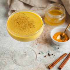 Moon milk for better sleep. Turmeric Golden milk with cinnamon. relaxing drink before going to bed. Ayurvedic drink.