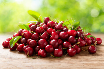fresh ripe cherries on a wooden table