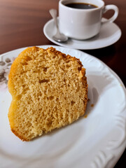 Delicious slice of orange cake with orange juice topping, perfect with coffee, tea, milk or juice at any time of the day.