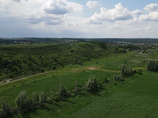 Aerial view of green hill on a cloudy day