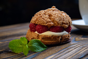 Fragrant French pastries, dessert. On a brown wooden table.
