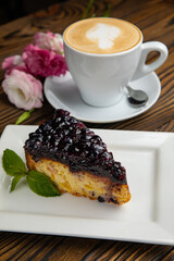 Fragrant French pastries, dessert. On a brown wooden table.

