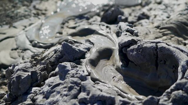 Close up shot of the mud exploding from the earth at the Mud Volcanoes in Temryuk, Russia