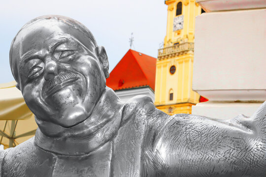 BRATISLAVA, SLOVAKIA - SEPTEMBER 01, 2019: The statue of Schoner Naci by Kaffee Mayer on Main square. Bratislava resident became famous for his unusual appearance and behavior