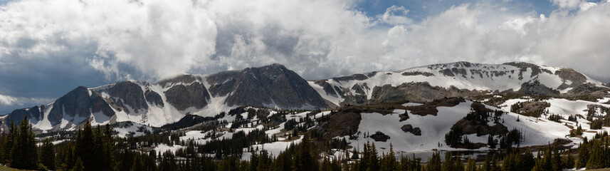 Fototapeta premium Wyoming's Snowy Range under storm clouds.