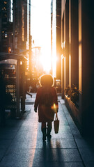 people walking in the city during sunset, 