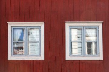 Background. Windows in a wooden house. Scandinavian architecture, old houses. Finland.