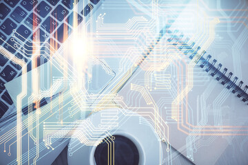 Double exposure of map hologram drawing over study table background with computer. Concept of international network. Top view.