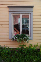 Fototapeta na wymiar Background. Windows in a wooden house. Scandinavian architecture, old houses. Finland.