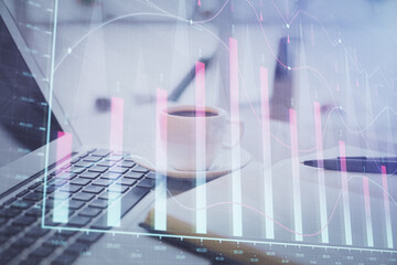 Double exposure of financial chart drawing and desktop with coffee and items on table background. Concept of forex market trading