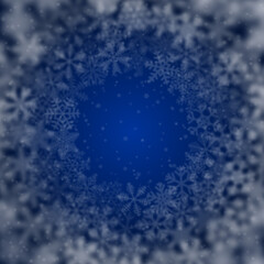 Christmas background of snowflakes of different shape, blur and transparency, arranged in a circle, on blue background