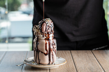 Icecream dessert with bitter chocolate sauce 