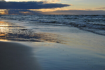 Beautiful sunset on a beach in Jurmala, Latvia. Sunset on the seashore.