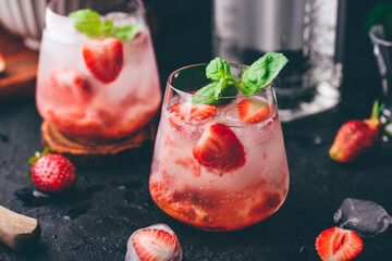 Cocktails with strawberry, gin and tonic