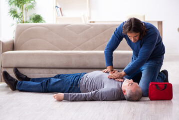 Grandfather and grandson in first aid concept