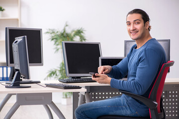 Young male it specialist working in the office