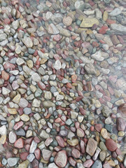 Dense Van Gogh style image of multi colored pebbles, seamless background, abstract pattern, digitally created from photo of pebbles, oil painting style, pure water effect, calm peaceful feeling of joy