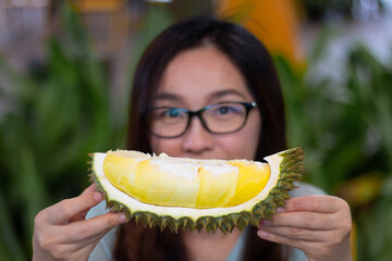 Asian young woman holding Durian