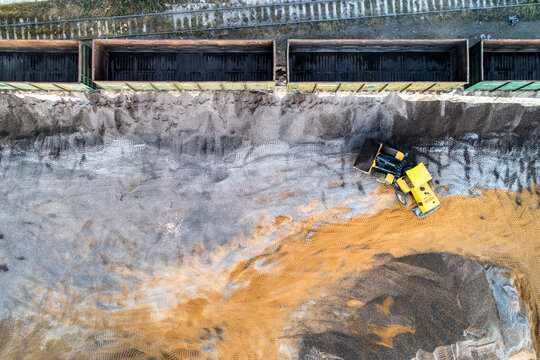 Precast concrete plant. A platform for unloading inert materials from freight railway cars. Crushed stone unloading.