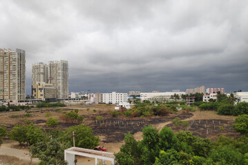 view of the city with rain clouds