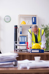 Old male architect working in the office © Elnur