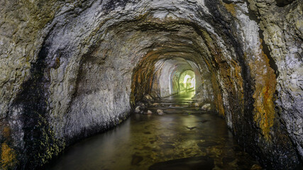 Abandoned Ocean Shore Railroad Creek Tunnel in Davenport, California, USA.
