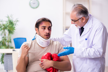 Young face injured man visiting experienced male doctor traumato