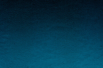 Blue genuine text and background of leather in shade black and blue.
