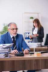 Two employees working in the office