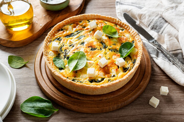 Vegetarian spinach pie or quiche with feta cheese .