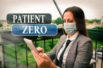 Conceptual hand writing showing Patient Zero. Concept meaning primary disease carrier of the highlycontagious disease Promoting health awareness with precautionary medical equipment