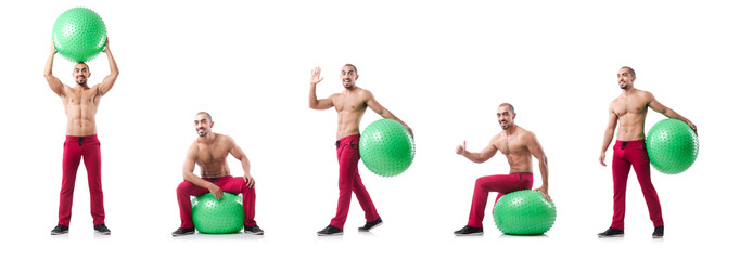 Man with swiss ball doing exercises on white