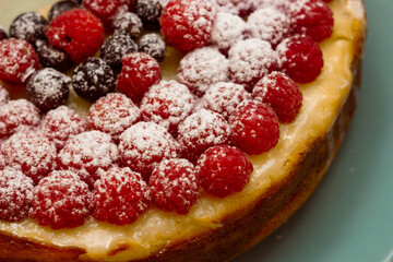 Homemade Cheesecake with Fresh Raspberries and Currants - Healthy Organic Summer Dessert Cheesecake Pie. Vanilla Cheese Cake with Wild Berry