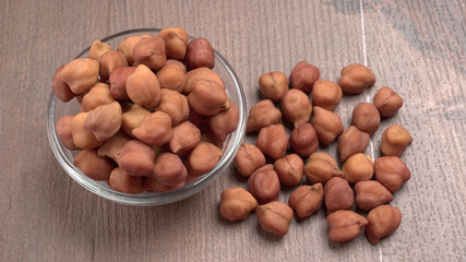 Black Chickpeas or Kala Chana with chana dal pulse isolated on wooden Background.
