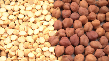 Black Chickpeas or Kala Chana with chana dal pulse isolated on wooden Background.