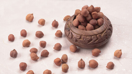 Black Chickpeas or Kala Chana with chana dal pulse isolated on wooden Background.