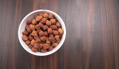 Black Chickpeas or Kala Chana with chana dal pulse isolated on wooden Background.
