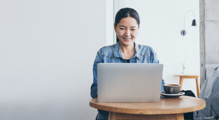 using computer.woman hand typing keyboard laptop online chatting search form internet while working sitting at coffee shop.concept for.technology device contact communication business people