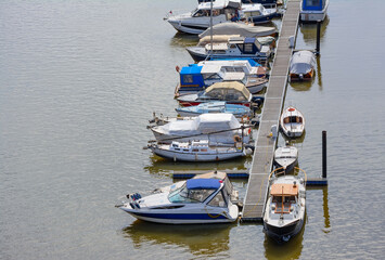 Fototapeta na wymiar Yachts at the berth on the Vltava River