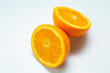Sliced fresh orange fruit on white background