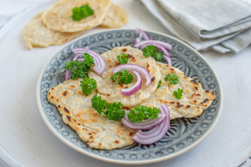 Onion naan - traditional indian bread. pita bread or scones with green onions