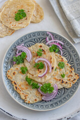 Onion naan - traditional indian bread. pita bread or scones with green onions