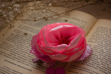 Handmade hair pins on an old vintage book with dried flowers
