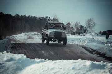 Dirty race cars ride off-road at competitions