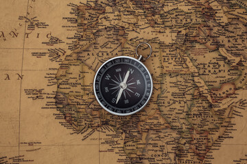 Fototapeta na wymiar Compass on old map. Travel concept