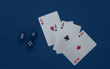Four aces and dice on a classic blue background.