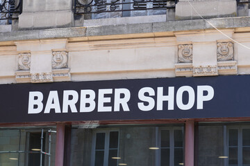 Fototapeta na wymiar barber shop sign text of store vintage wall building