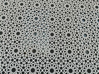 Beautiful modern Arabesque pattern/design originating from ancient Islamic civilization in the Middle East. The motif has linear interlacing line elements, resulting in repetitive geometric forms.