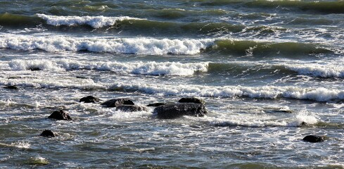 Waves chrashing the  rocks on the beach